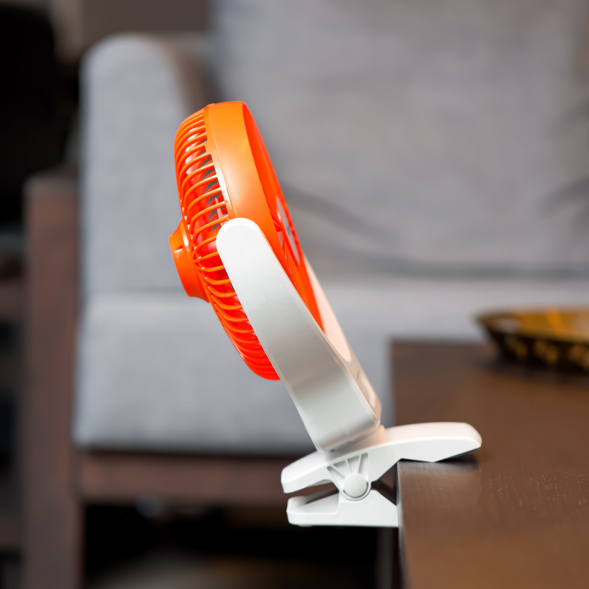 8 Inch Multi Angle LED Clip Fan, 9 Hours Working Time, AC/DC Function, 1500 mAh Lithium Battery, Two Level LED, Up/Down Tilting, Charging Indicator, Full Charged Indicator, Working Indicator GF21121 Orange & white